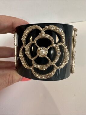 CHANEL Black Resin Cuff Bracelet with Gold-Tone Camellia and Pearls